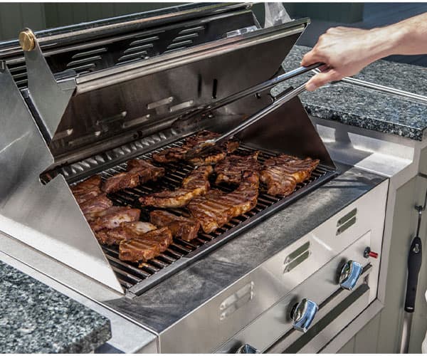 natural gas grill with steaks